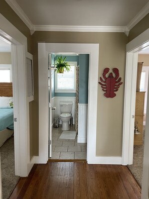 Combined shower/bathtub, towels, soap, toilet paper