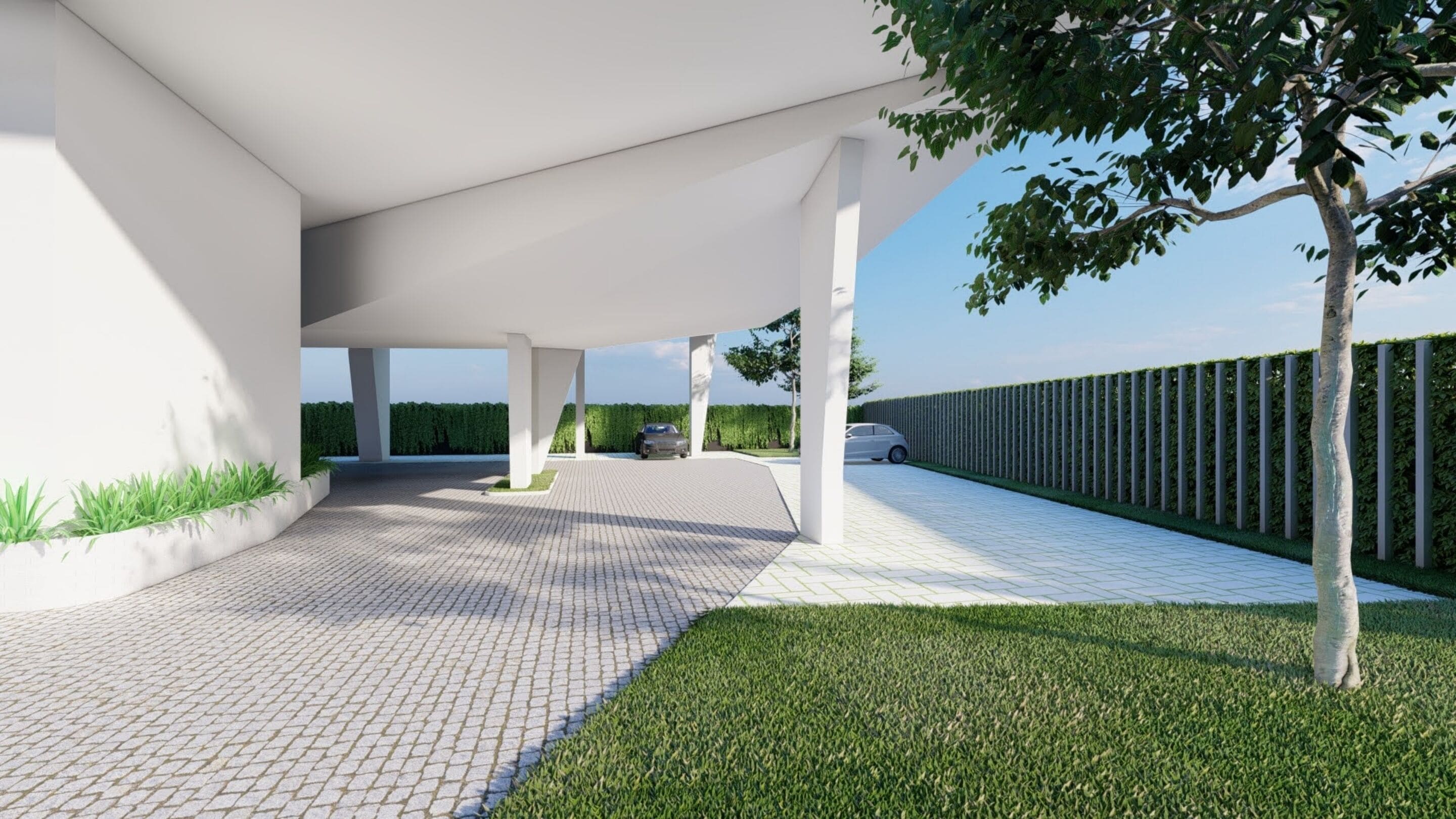 A covered outdoor area with a paved walkway, a tree, and a hedge.