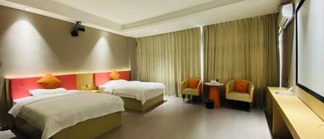 A hotel room with two beds, a desk, a chair, and a large window with curtains.