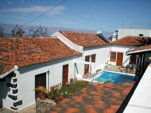 Relax in an outdoor space with a small pool and well-maintained garden.