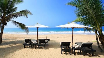 On the beach, sun-loungers, beach towels