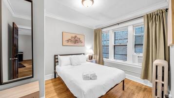 1 bedroom, desk, iron/ironing board, travel crib