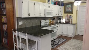 Microwave, dishwasher, coffee/tea maker, cookware/dishes/utensils