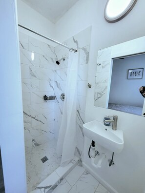 Shower, hair dryer, towels, soap