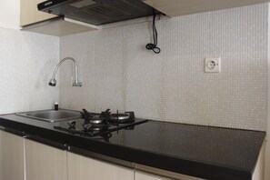 Room | Private kitchen | Fridge, stovetop, cookware/dishes/utensils - Pool View 2Br Apartment At The Jarrdin Cihampelas (Bandung)