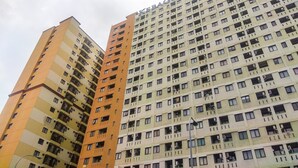 A high-rise building with multiple balconies and a uniform facade. - Best Deal And Comfy 2Br At Kebagusan City Apartment (Jakarta)