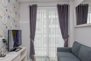 Habitación | Área de sala de estar | Televisión 