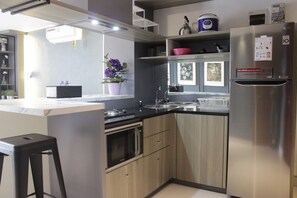 Private kitchen - Modern & Cozy 2Br Apartment At Tamansari Tera Residence (Bandung)