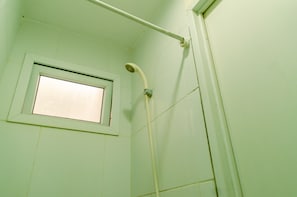 Room | Bathroom | Shower, free toiletries, towels - Comfy Studio Apartment At Aeropolis Residence Near Soetta (Tangerang)