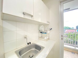 Room | Private kitchen | Fridge, stovetop, cookware/dishes/utensils - Relaxing 1Br Apartment At Parahyangan Residence Near Parahyangan University (Bandung)