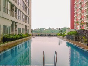 Outdoor pool - Warm And Nice Studio Apartment At Taman Melati Margonda (Depok)
