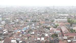 A densely packed residential area with numerous houses and buildings.