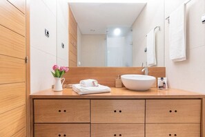 Shower, hair dryer, towels, toilet paper