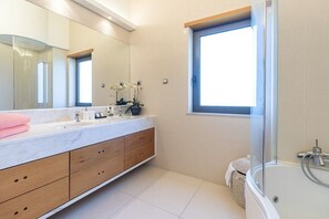 Shower, hair dryer, towels, toilet paper