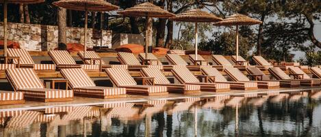 Outdoor pool, open 8:00 AM to 9:00 PM, pool umbrellas, pool loungers