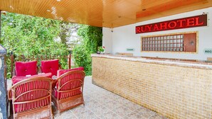 A reception area with a wooden ceiling, a reception desk, and a sign that reads "RUYA HOTEL". - GARDEN RUYA HOTEL (Fethiye)