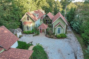 Stunning two-story house with a charming front porch and beautifully manicured lawn.