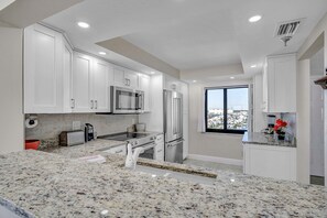 Fridge, microwave, oven, stovetop - Ocean Sands 1108 is a Gold 2-bedroom 2 bath Condo on the 11th floor (Madeira Beach)