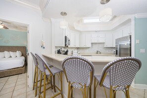 Enjoy cooking in this well-equipped kitchen with a central island and comfortable seating area.