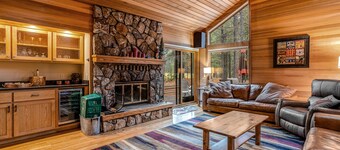 Forested getaway with kitchen, stone fireplace, pool, & private hot tub