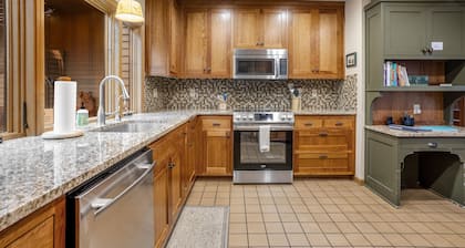 Forested getaway with kitchen, stone fireplace, pool, & private hot tub