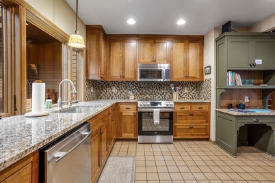 Forested getaway with kitchen, stone fireplace, pool, & private hot tub