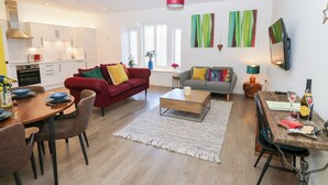 A modern apartment with a kitchen, dining area, and living room. - Over The Arch (Keighley)