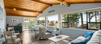 Log-style mountain and bay-view retreat with hot tub, game rooms, & balcony