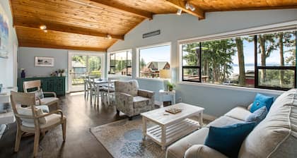 Log-style mountain and bay-view retreat with hot tub, game rooms, & balcony