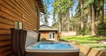Log-style mountain and bay-view retreat with hot tub, game rooms, & balcony