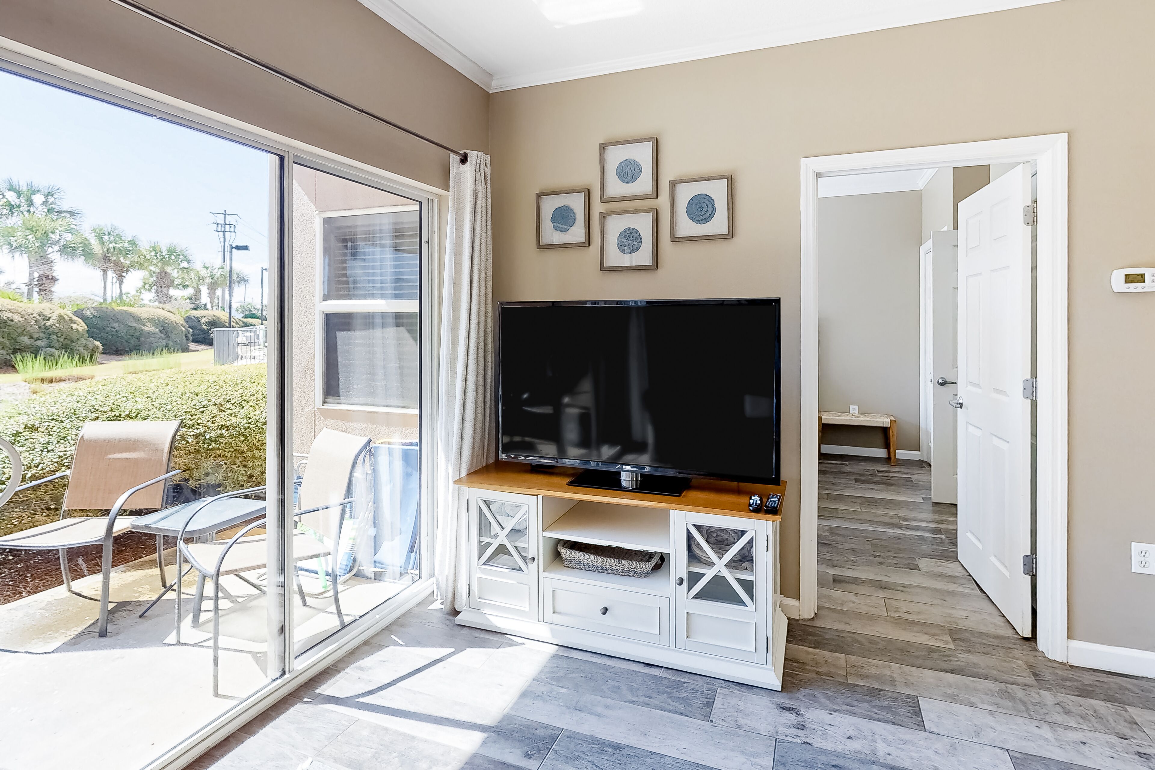 Updated, beachside condo with dual suites, balcony & pool - walkable locale