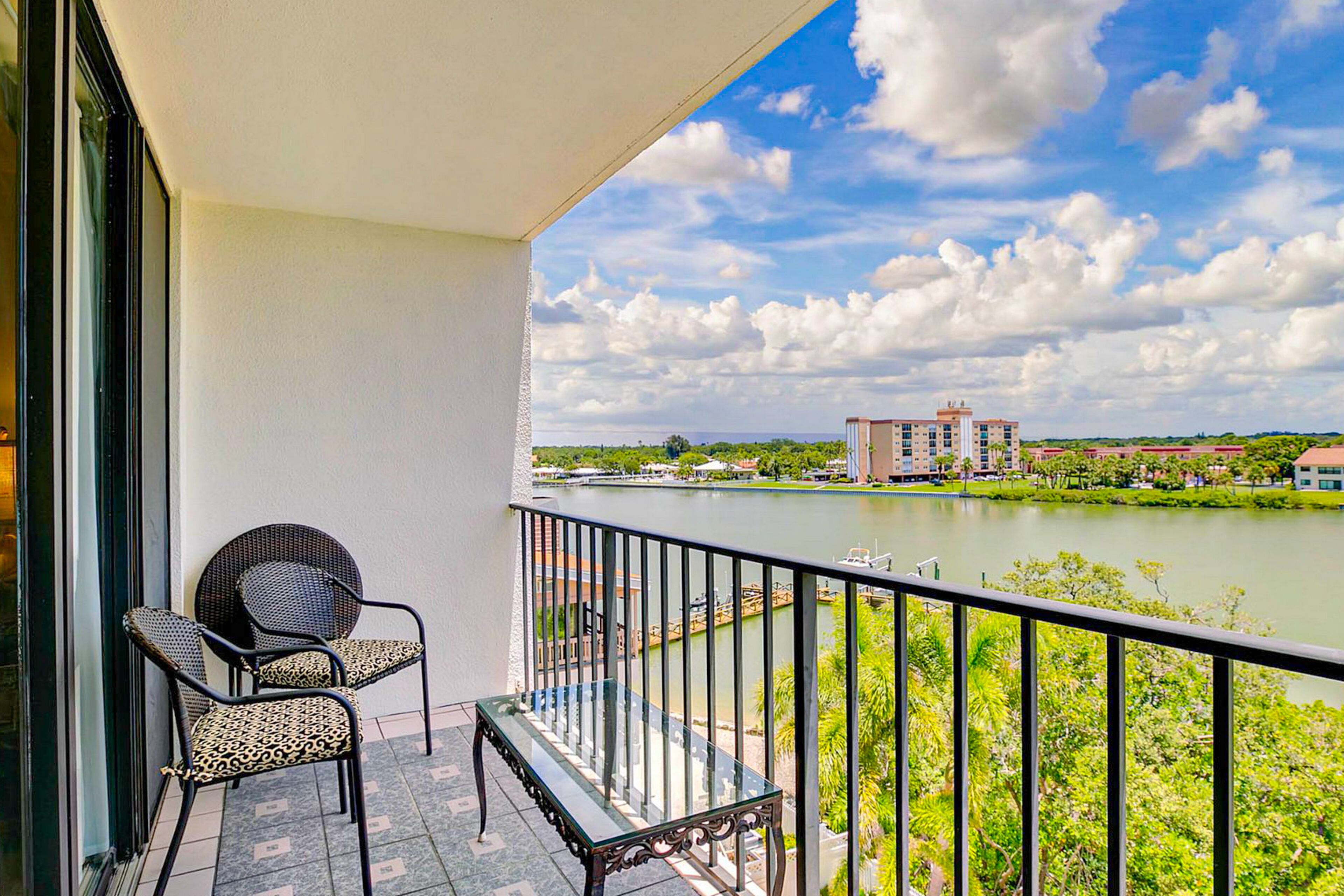 Waterfront condo with pool - directly across from wide beach