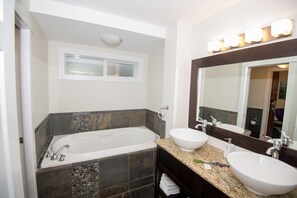 Combined shower/bathtub, hair dryer, towels, soap