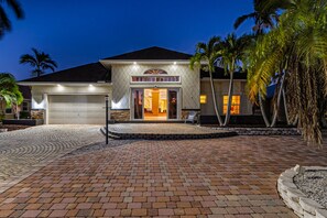 Exterior - Striking European-style home w/ private pool, hot tub & river access via dock (Cape Coral)