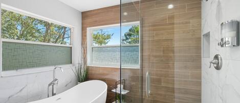 Bathtub, hair dryer, towels, soap
