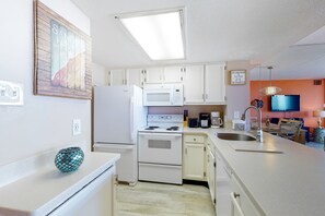 Fridge, microwave, oven, stovetop - Stunning beachfront condo with balcony, pools, game room, sauna & gym (Ocean City)