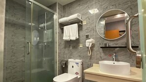 A modern bathroom with a glass shower enclosure, a toilet, a sink with a mirror, and a towel rack. - Shankee Chain Hotel (Shenzhen Longhua Qinghu Subway Station) (Shenzhen)