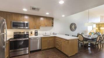 Fridge, stovetop, dishwasher, coffee/tea maker