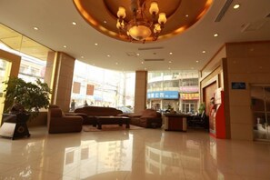 A hotel lobby with a chandelier, seating area, and large windows. - Laike Yangming Hotel (Chizhou)