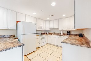 Fridge, microwave, oven, stovetop - Convenient Oceanside Condo with Balcony, Pool, Free WiFi & Elevator (Ocean City)