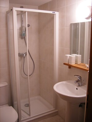 Combined shower/tub, hair dryer, towels, soap