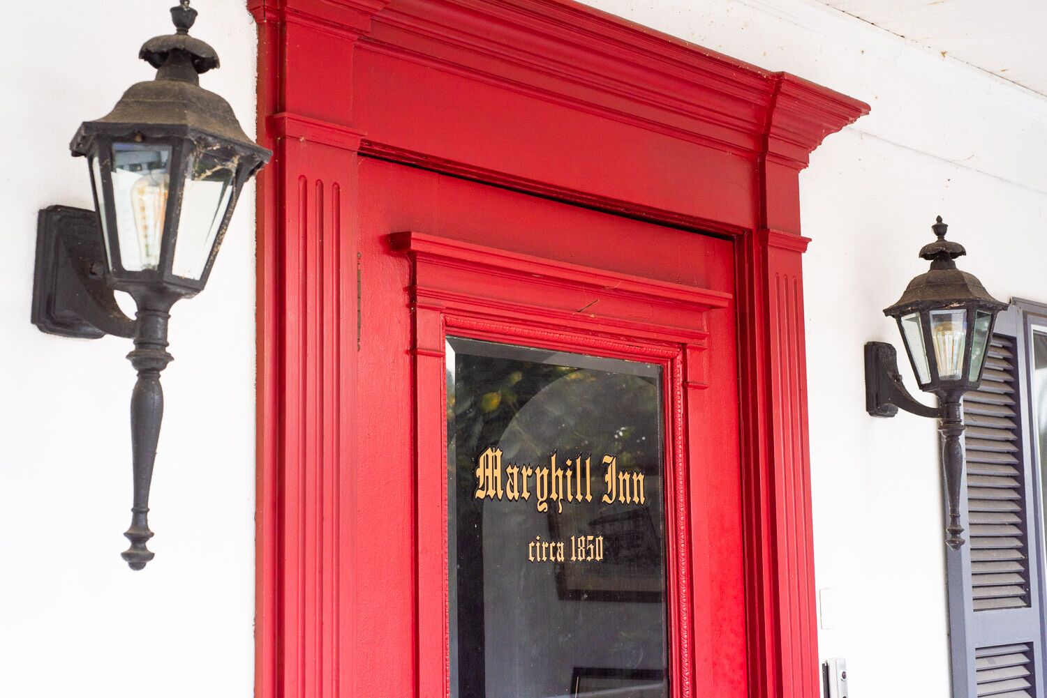A red building with the sign "Margaret Inn circa 1850" on the entrance.