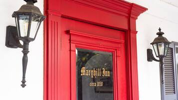 A red building with the sign "Margaret Inn circa 1850" on the entrance.