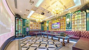 A luxurious lobby with a patterned floor, plush seating, and decorative lighting. - Time Platinum (Ziyun)