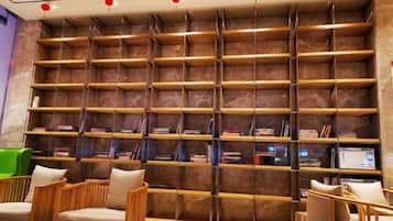 A library with bookshelves and seating areas.