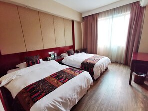 A hotel room with two beds, a wooden floor, a large window with curtains, and a wall-mounted TV. - Rongshui Miaoshan International Hotel (Liuzhou)