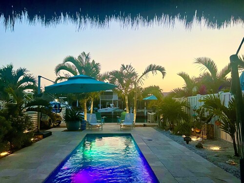 Luxurious Waterfront Oasis: 2BR,  Private Heated Pool, Tiki, Dock