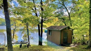 A small wooden cabin by a lake surrounded by trees. - Big Sandy Lake.  Beautiful and Private!<br><br> (McGregor)