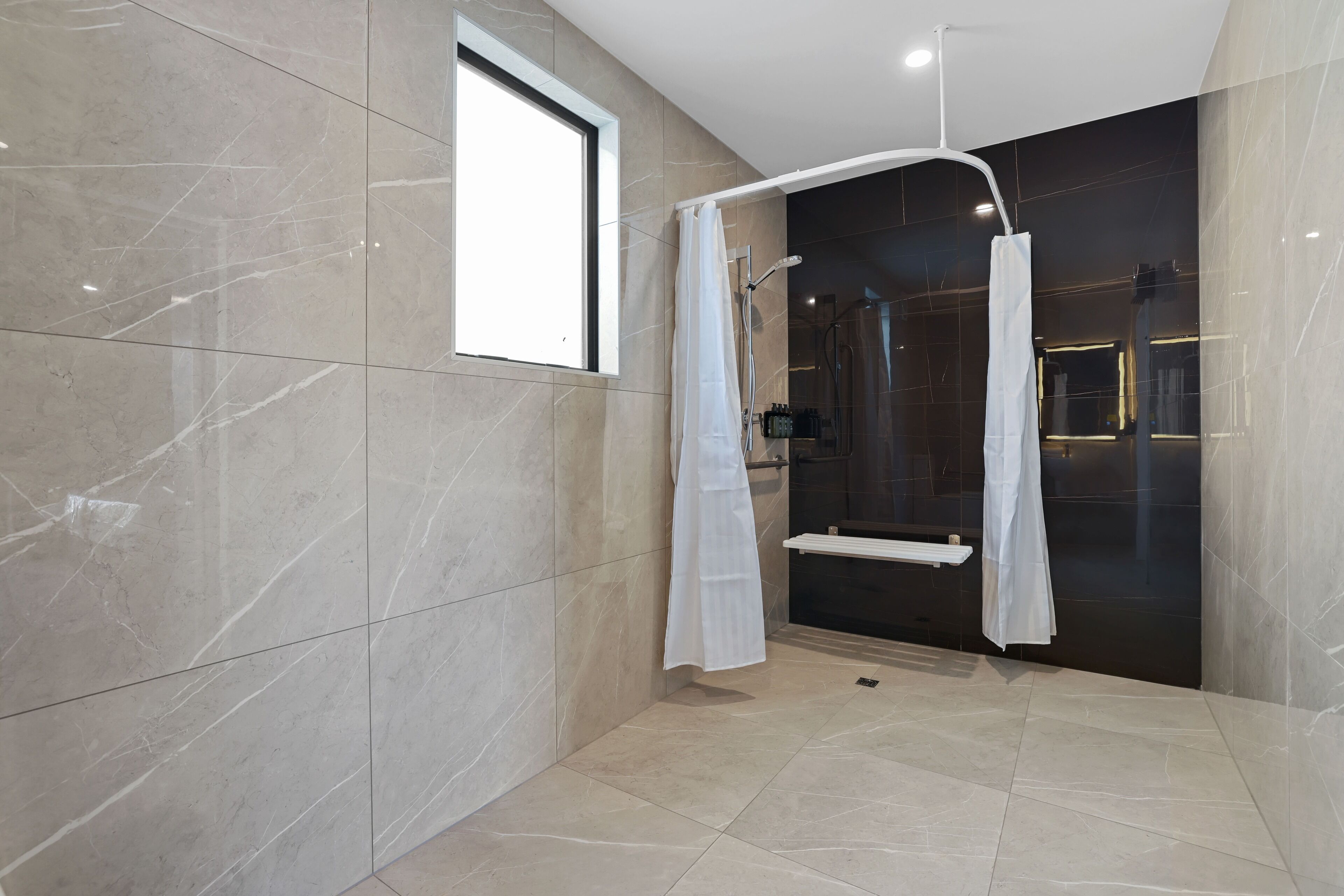 deluxe room, accessible | bathroom | shower, rainfall showerhead, free toiletries, hair dryer