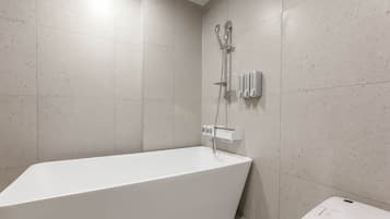 Separate bathtub and shower, hair dryer, bathrobes, bidet
